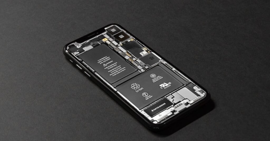 High-resolution image of a smartphone showcasing its internal components on a dark surface.